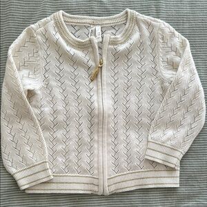 Elegant Cream baby’s cardigan